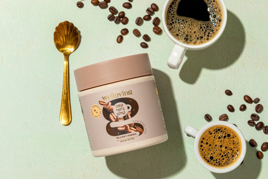 Two cups of coffee, scattered coffee beans, and collagen powder.