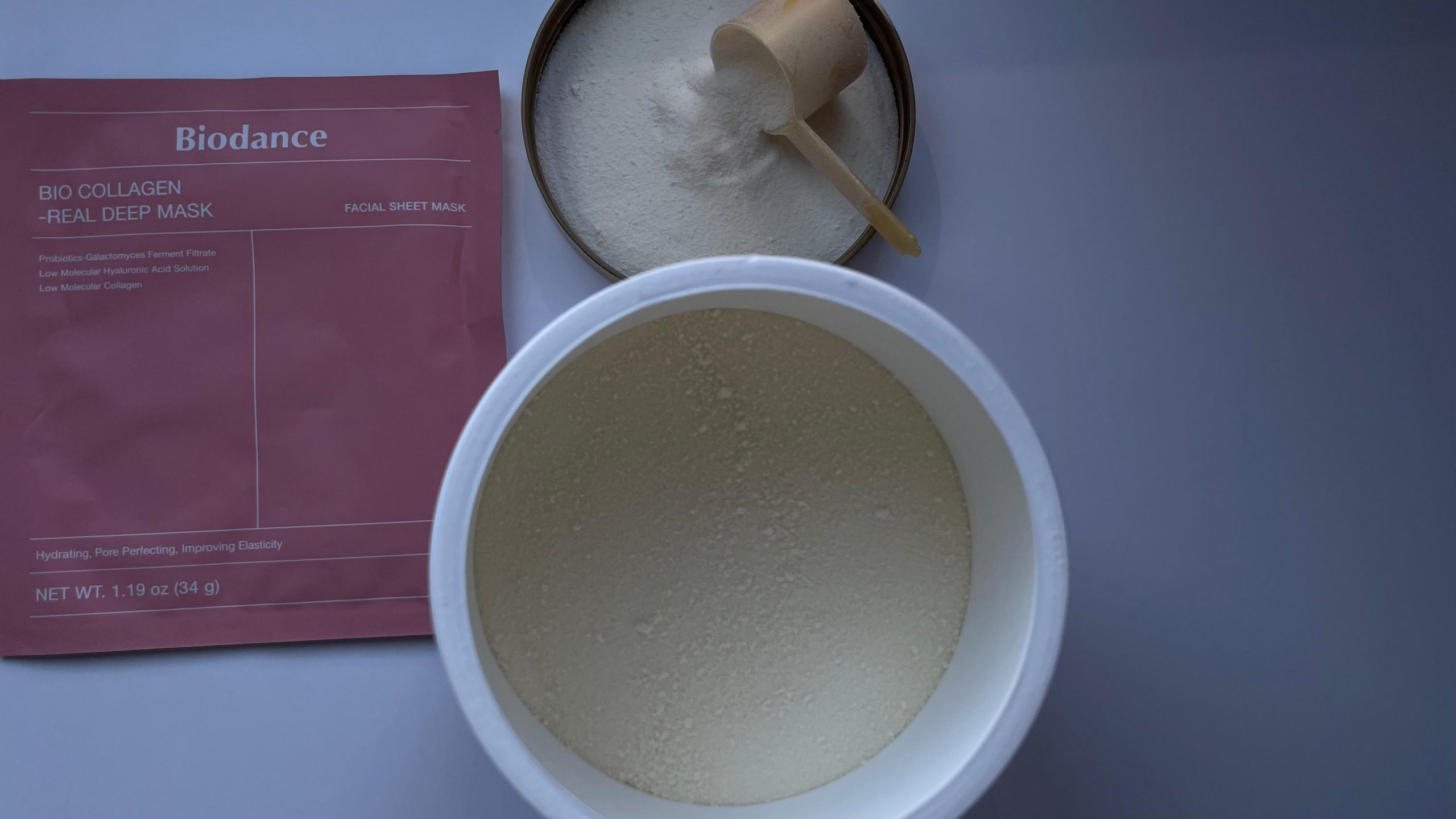 A collagen mask and powder are on the table