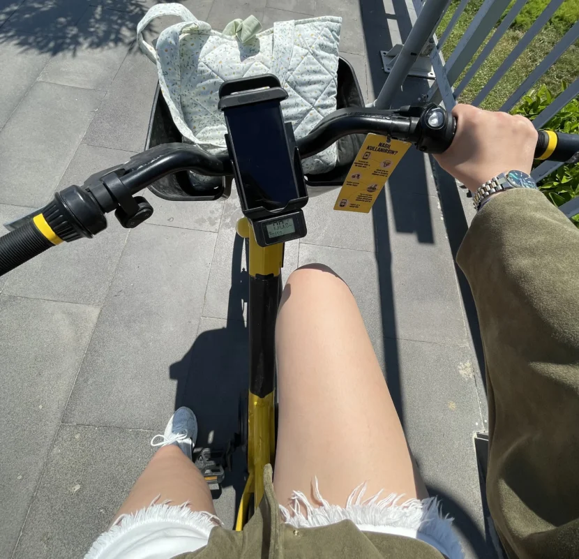 Cycling and biking on a blue coastal bike lane in Antalya with sea views, and city buildings under a bright sky.