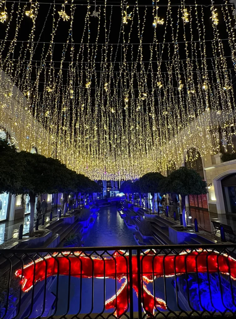 Things to do in Antalya The Land Of Legends at night with festive lights and illuminated streets