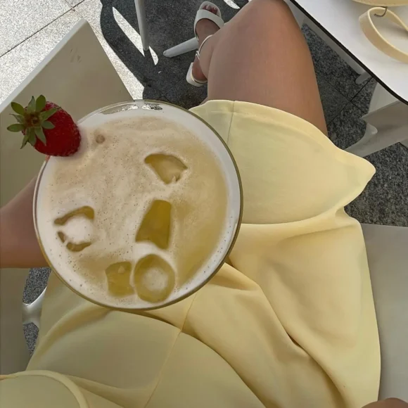 Easy cocktail recipes at home featuring a creamy tropical Piña Colada with ice and fresh strawberry garnish
