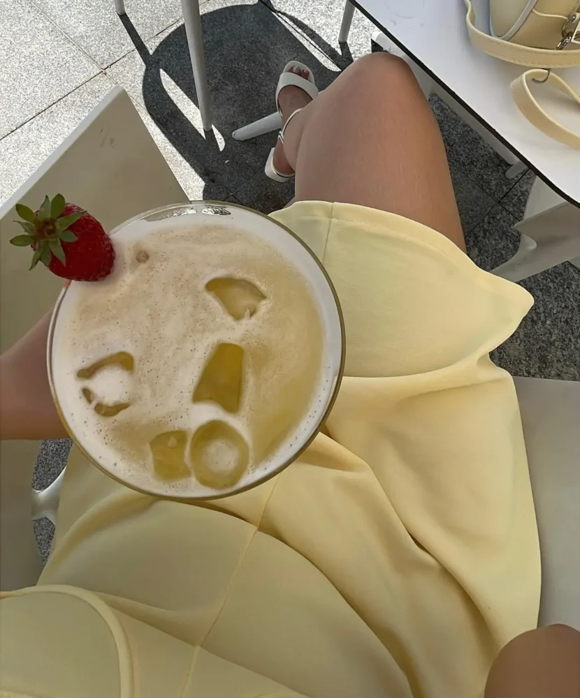 Easy cocktail recipes at home featuring a creamy tropical Piña Colada with ice and fresh strawberry garnish