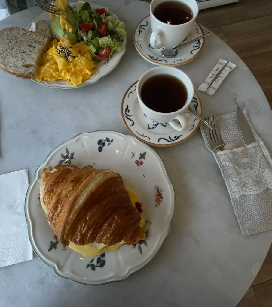 Breakfast in Antalya at Sara Bakery with buttery croissant sandwiches, scrambled eggs, fresh salad and traditional Turkish tea.