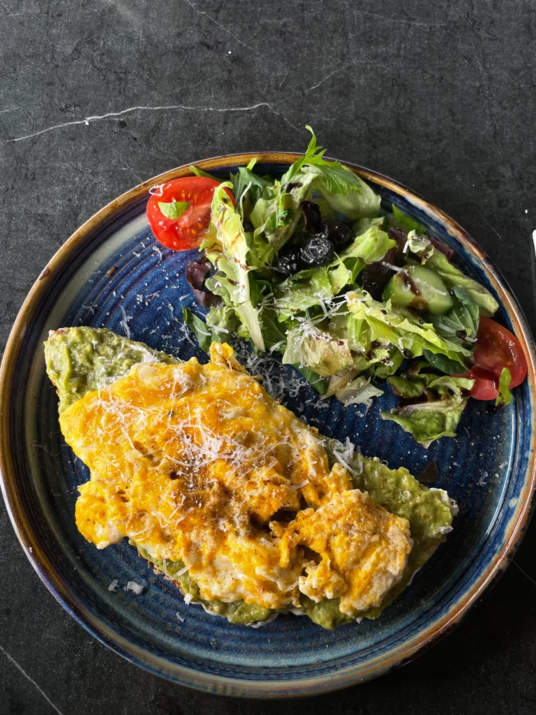 Breakfast in Antalya at Shakespeare Bistro with scrambled eggs, avocado toast, fresh salad and a light, protein-rich brunch plate.